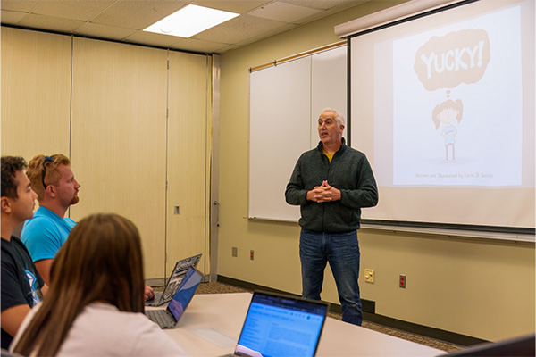 Dr. Kevin Smith teaching his book, Yucky.
